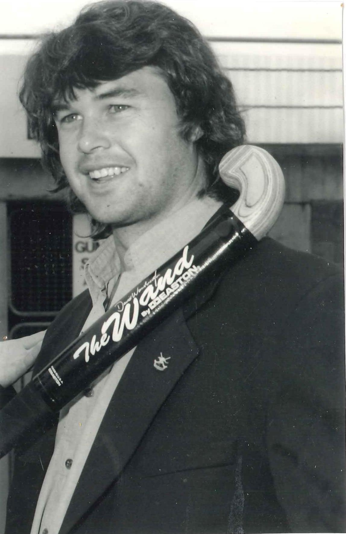 Stephen Davies, sans headband, posing with "The Wand". John Davies says this was a popular hockey stick at the time. Made by Easton it was aluminium frame with a wooden head. They were later banned by FIH due to the wooden head detaching from the aluminium! Photograph courtesy of John and Brenda Davies