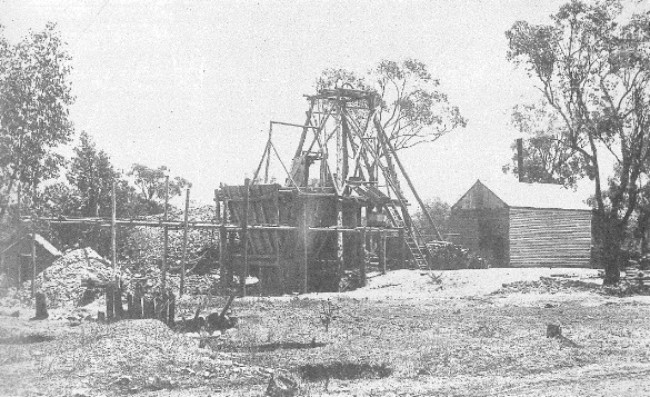 Photograph of Koh-I-Noor Mine from Ian Chambers' fascinating book Parkes: A Photographic History. Chambers states that the mine was situated on land between the present golf club and the Forbes Road. The photograph dates back to the turn of the century and displays the "modern" wood-fired boiler (the shed on the right). Serious losses were experienced in winter due to the damage to the mine by the snow and also lack of procuring firewood for the boiler. Sources: Chambers, I. (1988). Parkes: A Photographic History. Parkes, N.S.W.: I. Chambers; and Western Champion Friday 7 December 1900 page 11